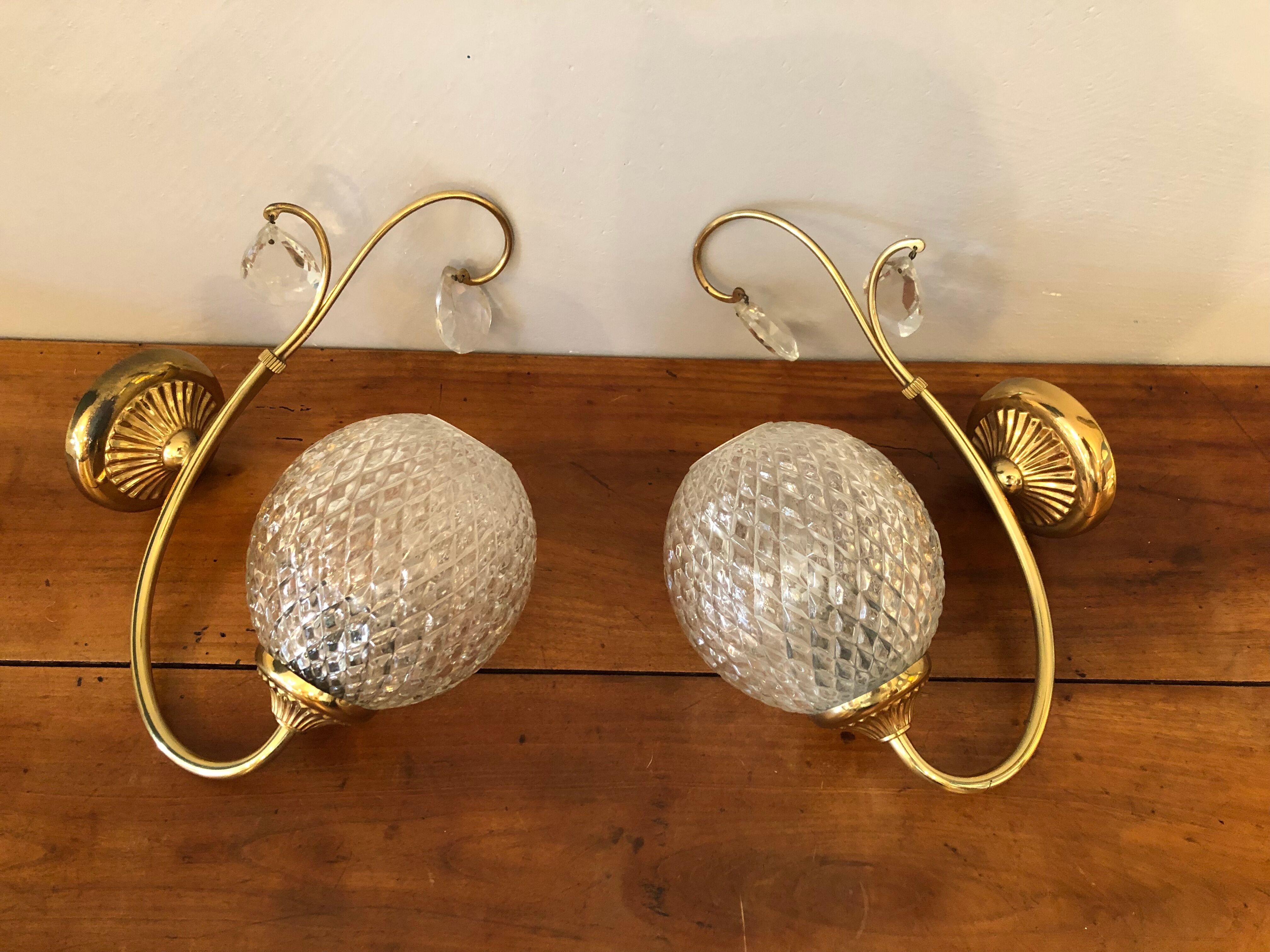 Duo of brass and glass wall lamps