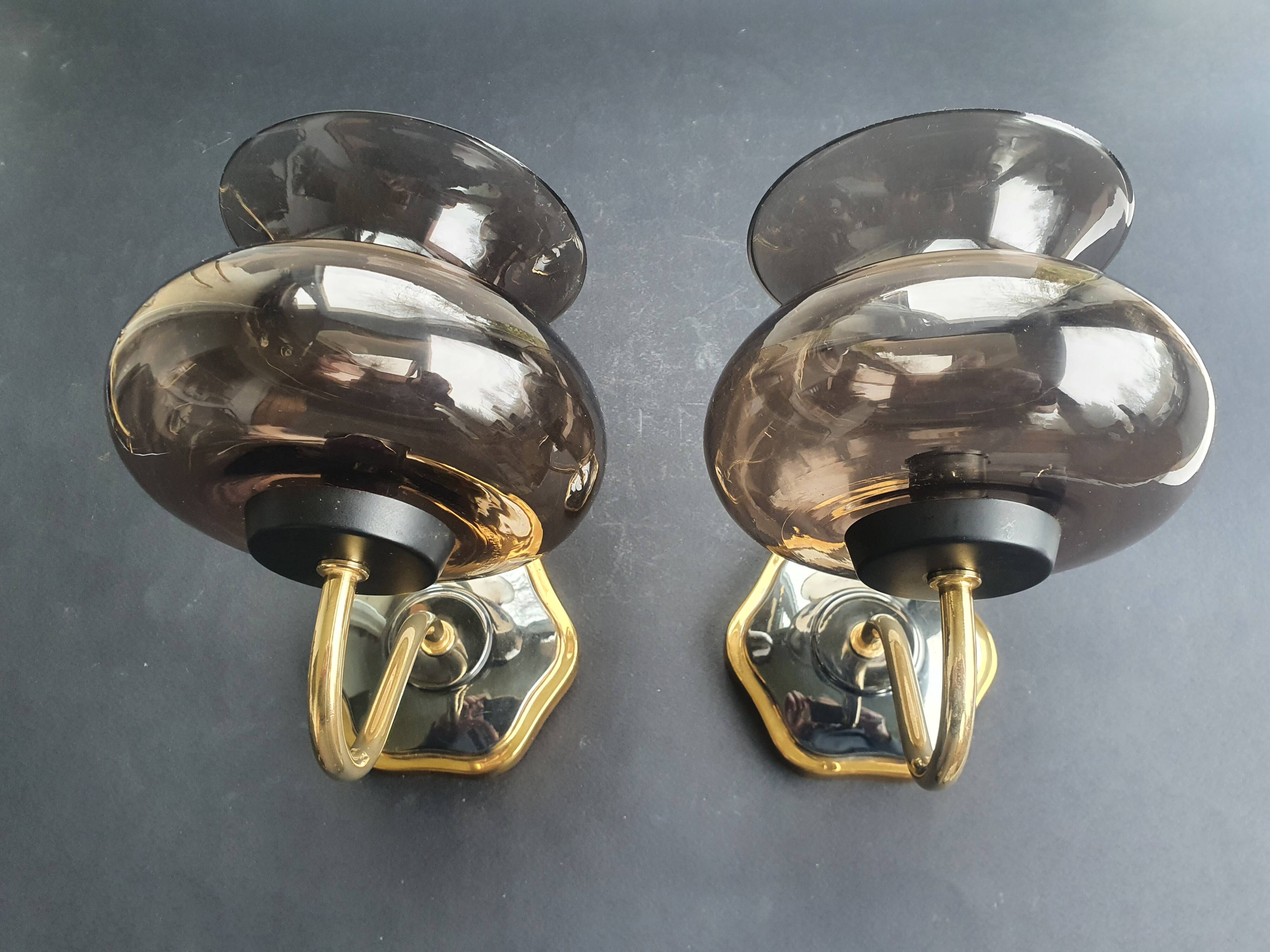 Pair of antique gold-plated brass and smoked glass wall lights.