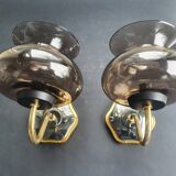 Pair of antique gold-plated brass and smoked glass wall lights.