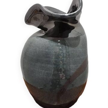 Enamelled vase signed by Thomas Buxo in an asymmetrical free form.