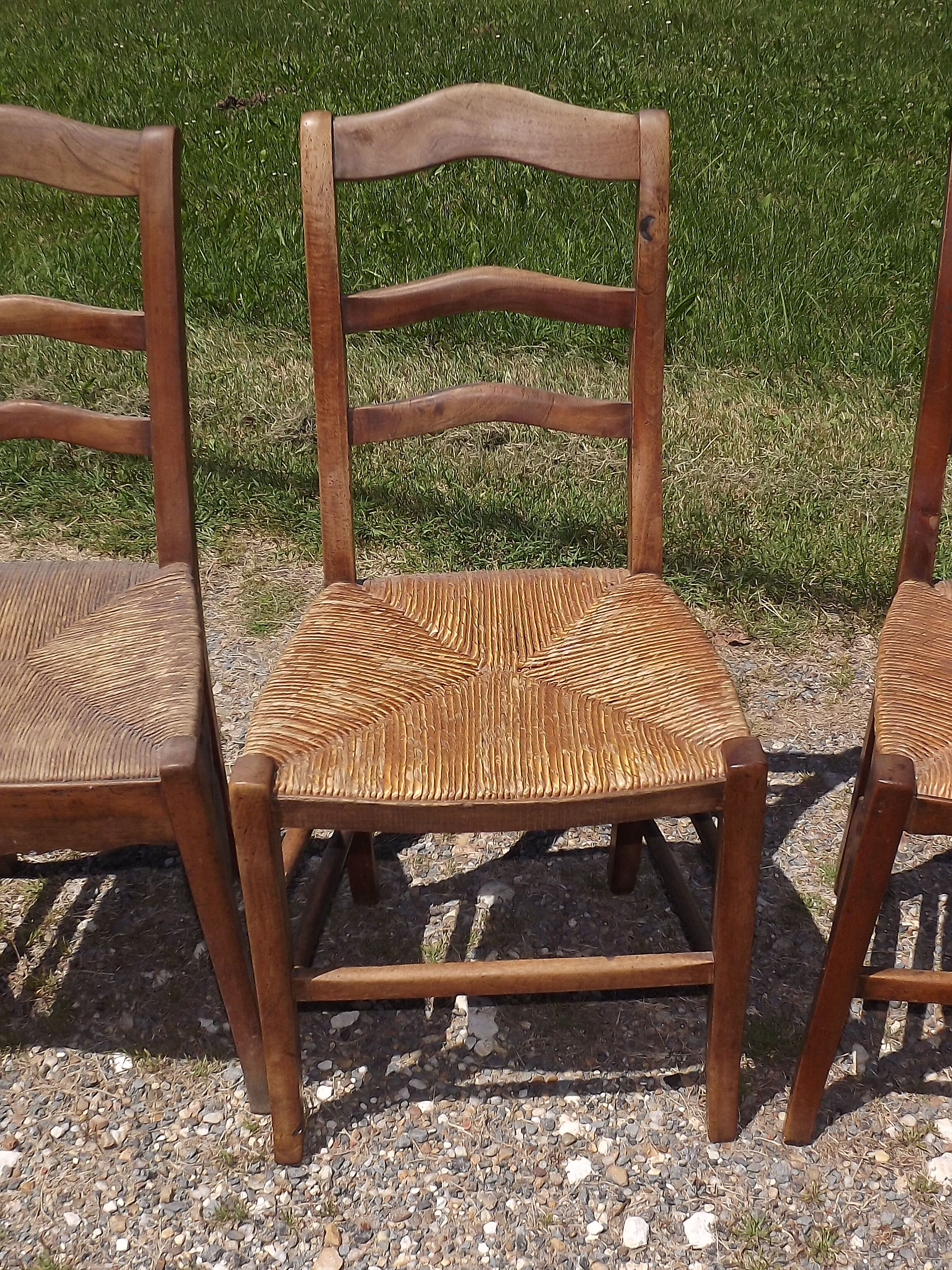 17 old straw chairs