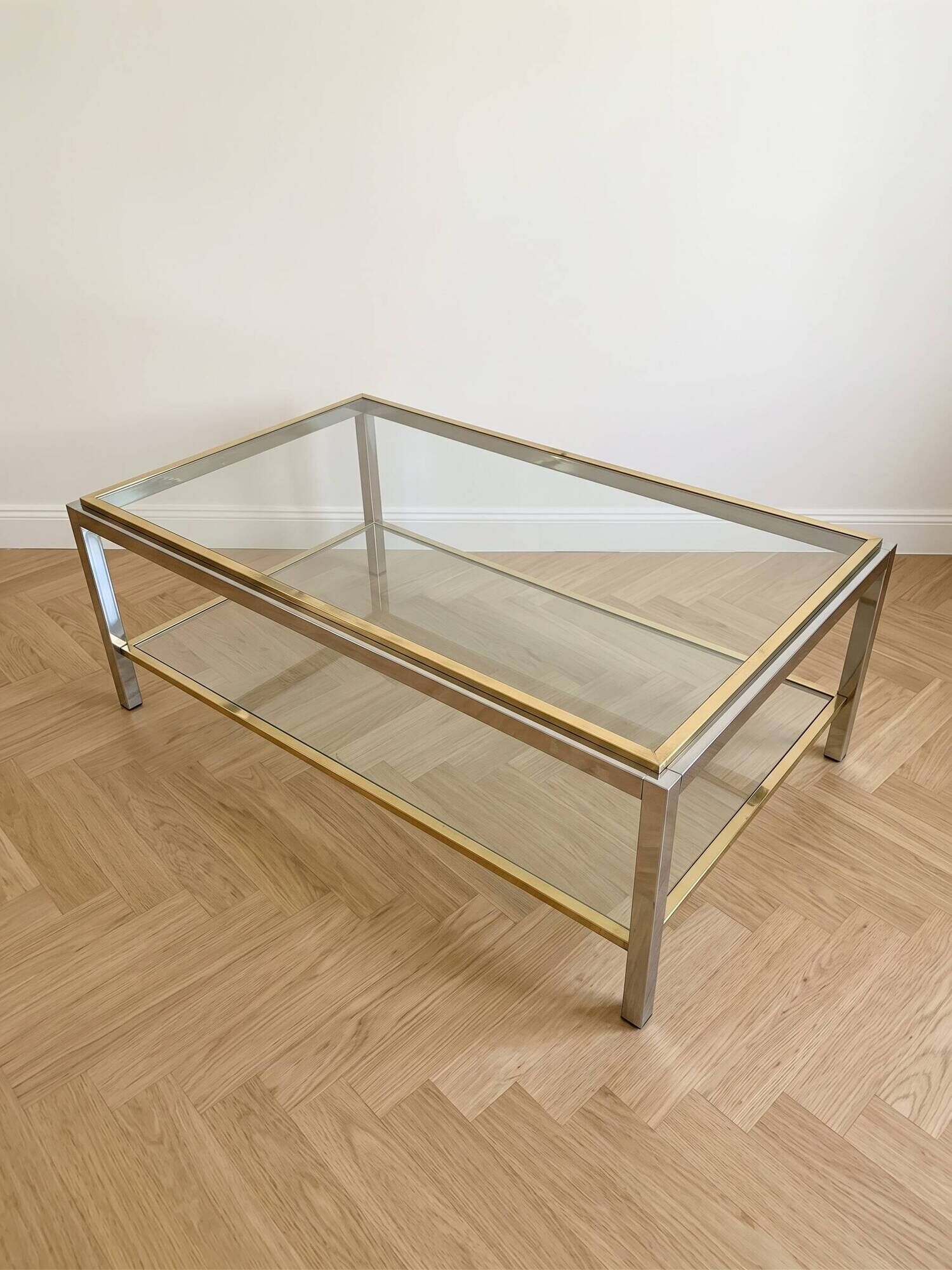 Vintage 1970s coffee table in brass and chrome in the style of Willy Rizzo.