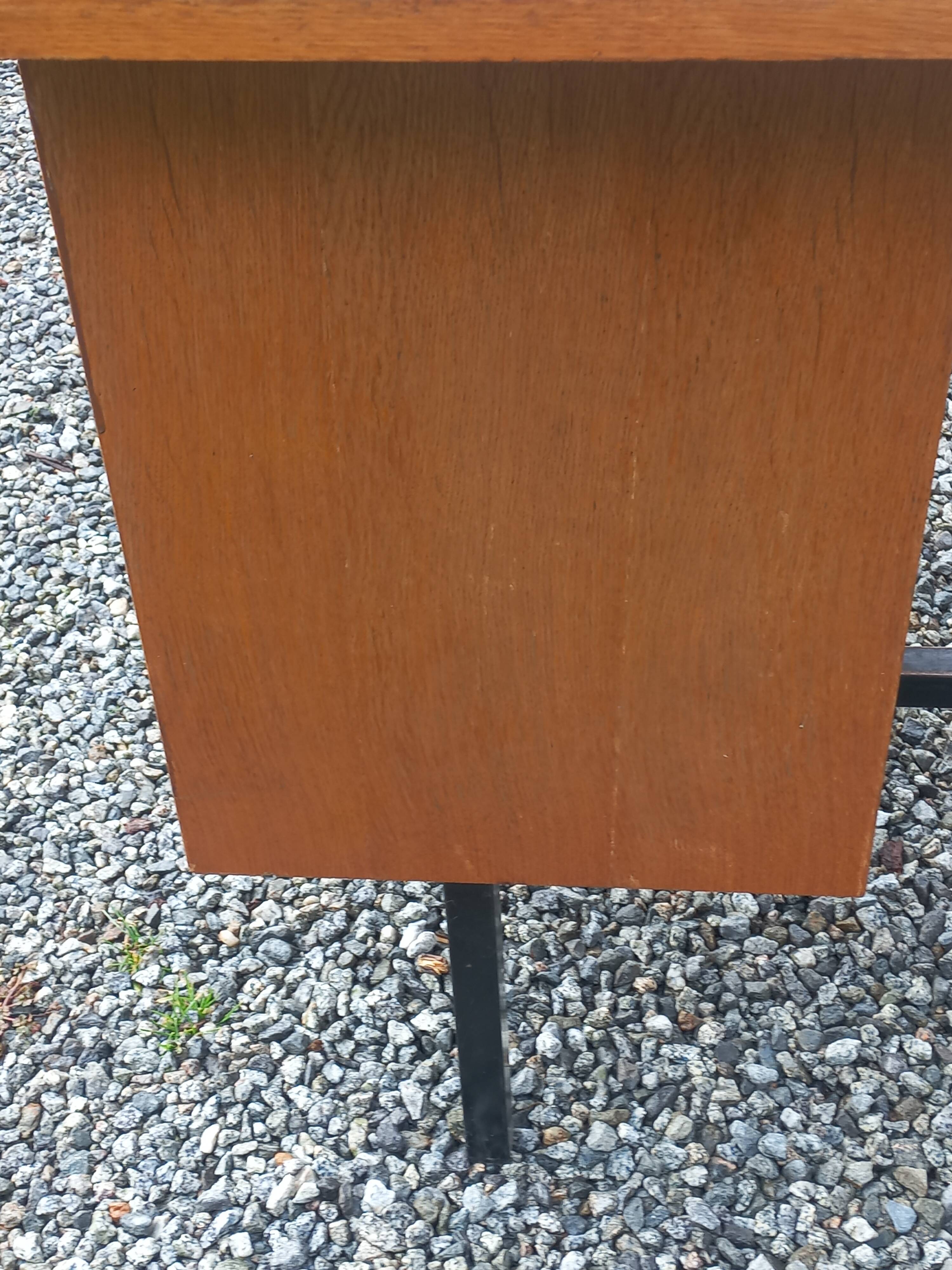 Vintage oak desk with a metallic base from the 1960s.