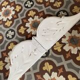 White patinated wooden pediment.