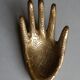 Empty-pocket brass hand