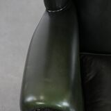 Smooth classic cowhide Chesterfield armchair in a stylish dark green color