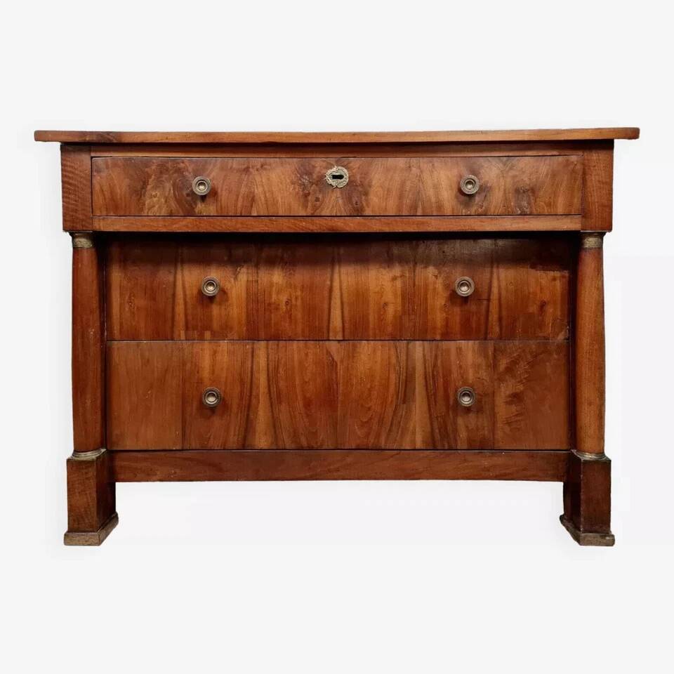 Empire period chest of drawers in walnut and gilded bronze circa 1810-1820