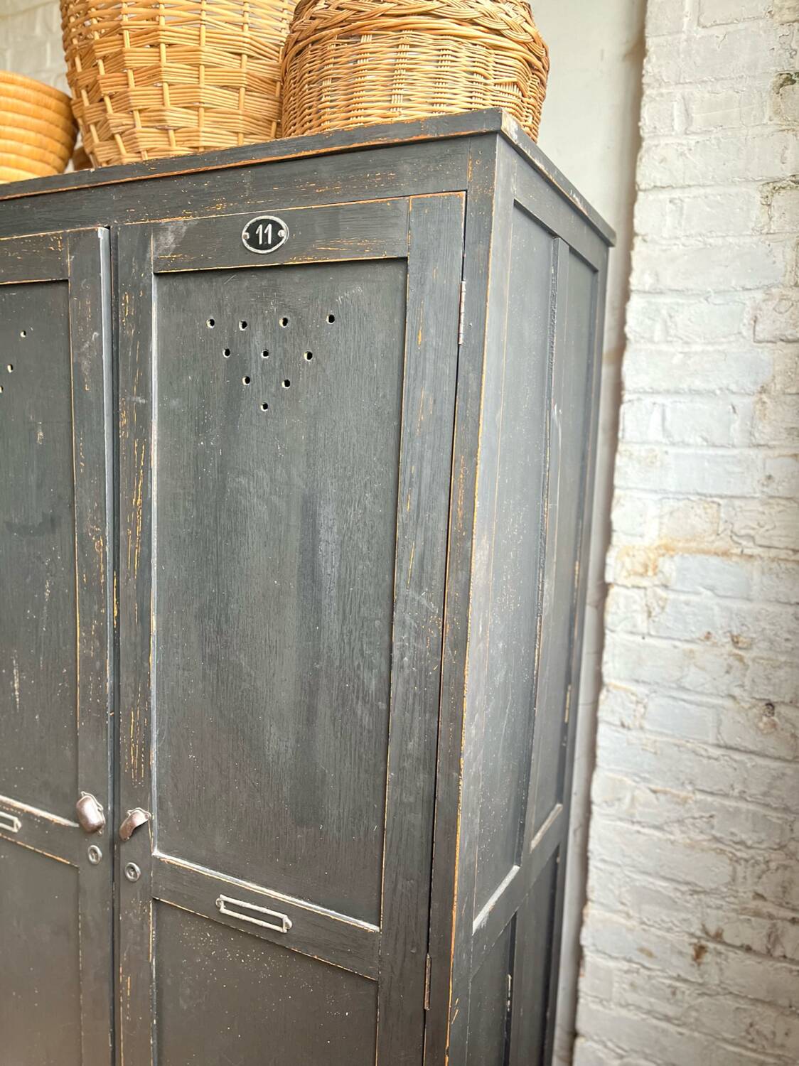 Old wooden locker with black patina