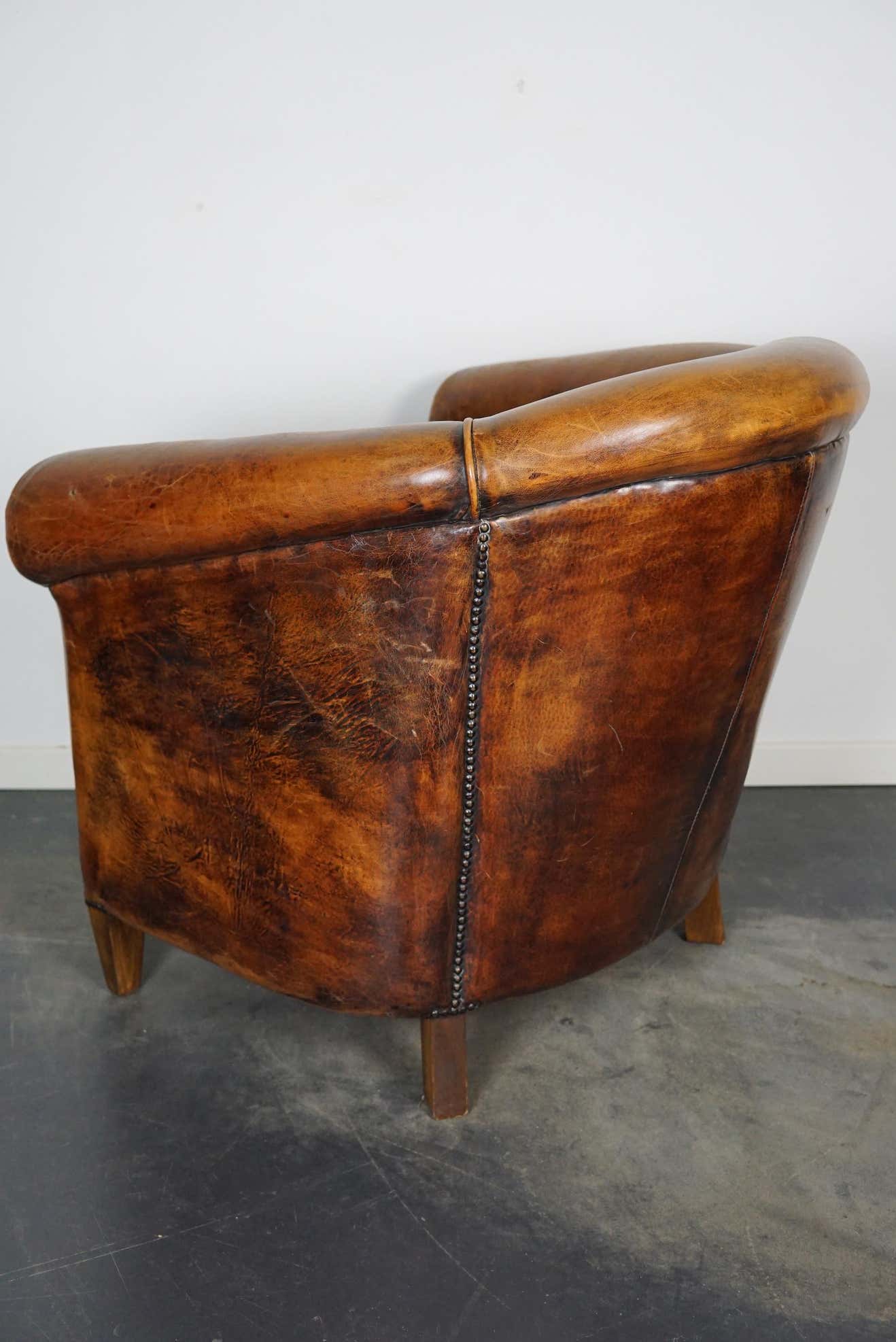 Vintage club armchair in leather color cognac Netherlands