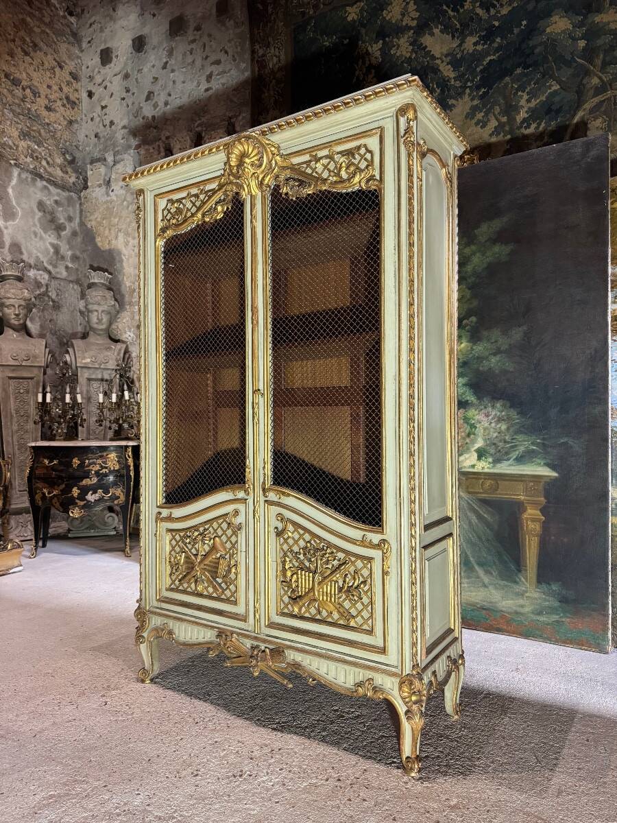 Bookcase in gilded wood and restored wood from the Napoleonic III period.