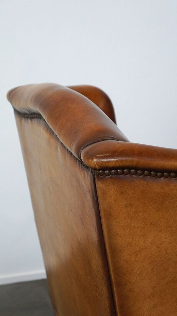 Fauteuil à oreilles en cuir de mouton marron