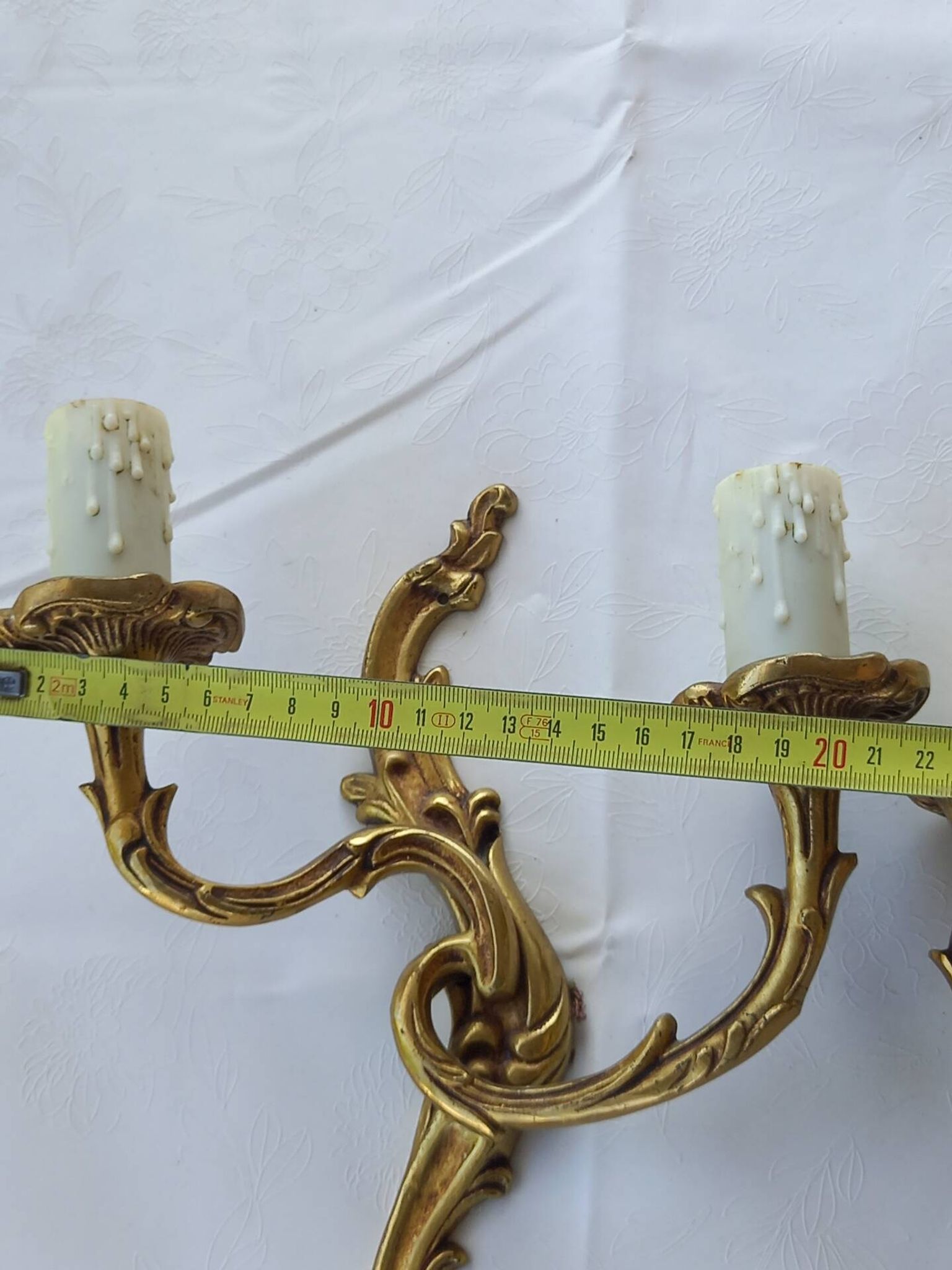Old pairs of bronze wall sconces