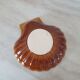 Brown and white ceramic shell bowl