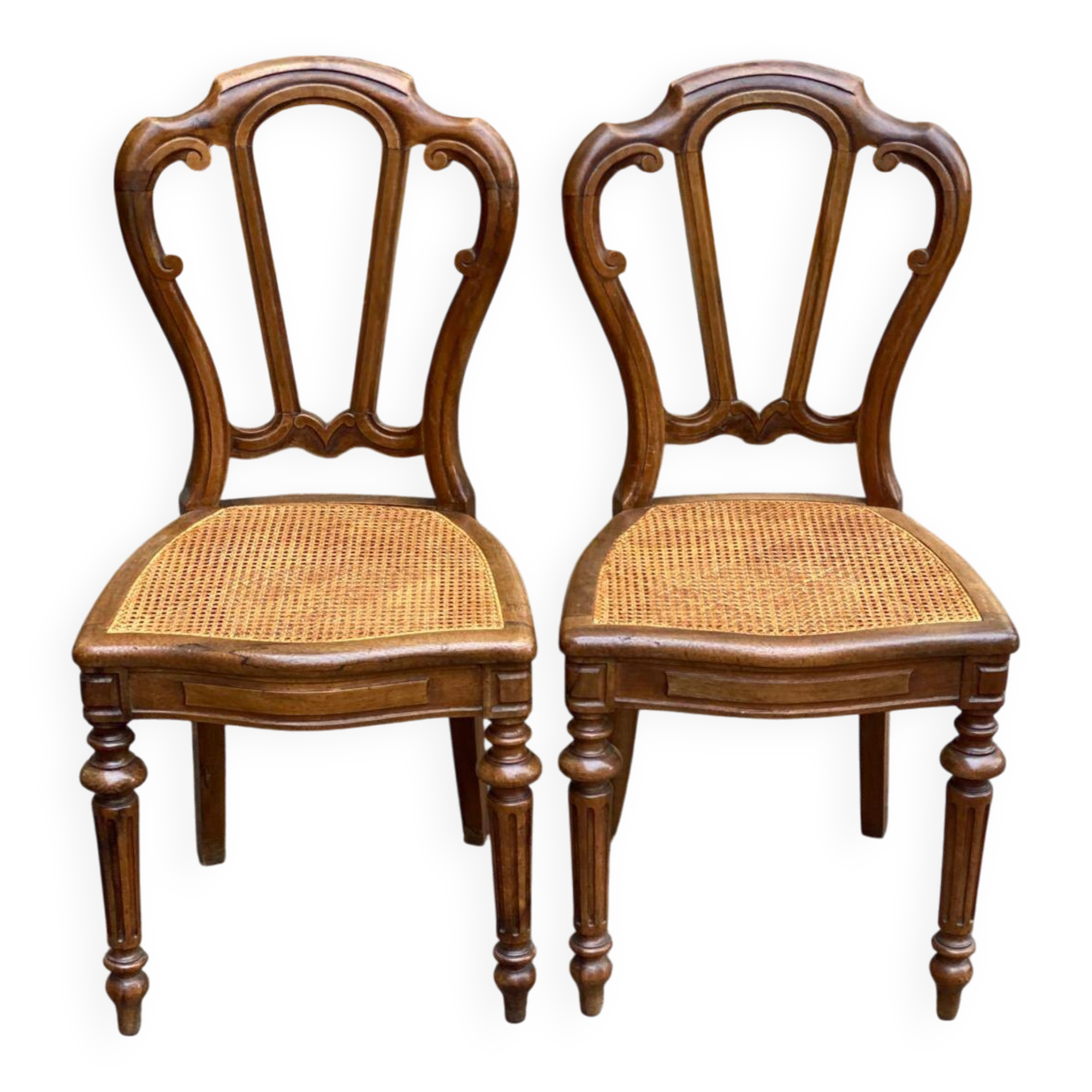 2 chaises Louis Philippe en bois massif sculpté et cannées du 19ème