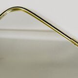 Elegant wall mirror in brass and black from the mid-century, Italy, 1950s.