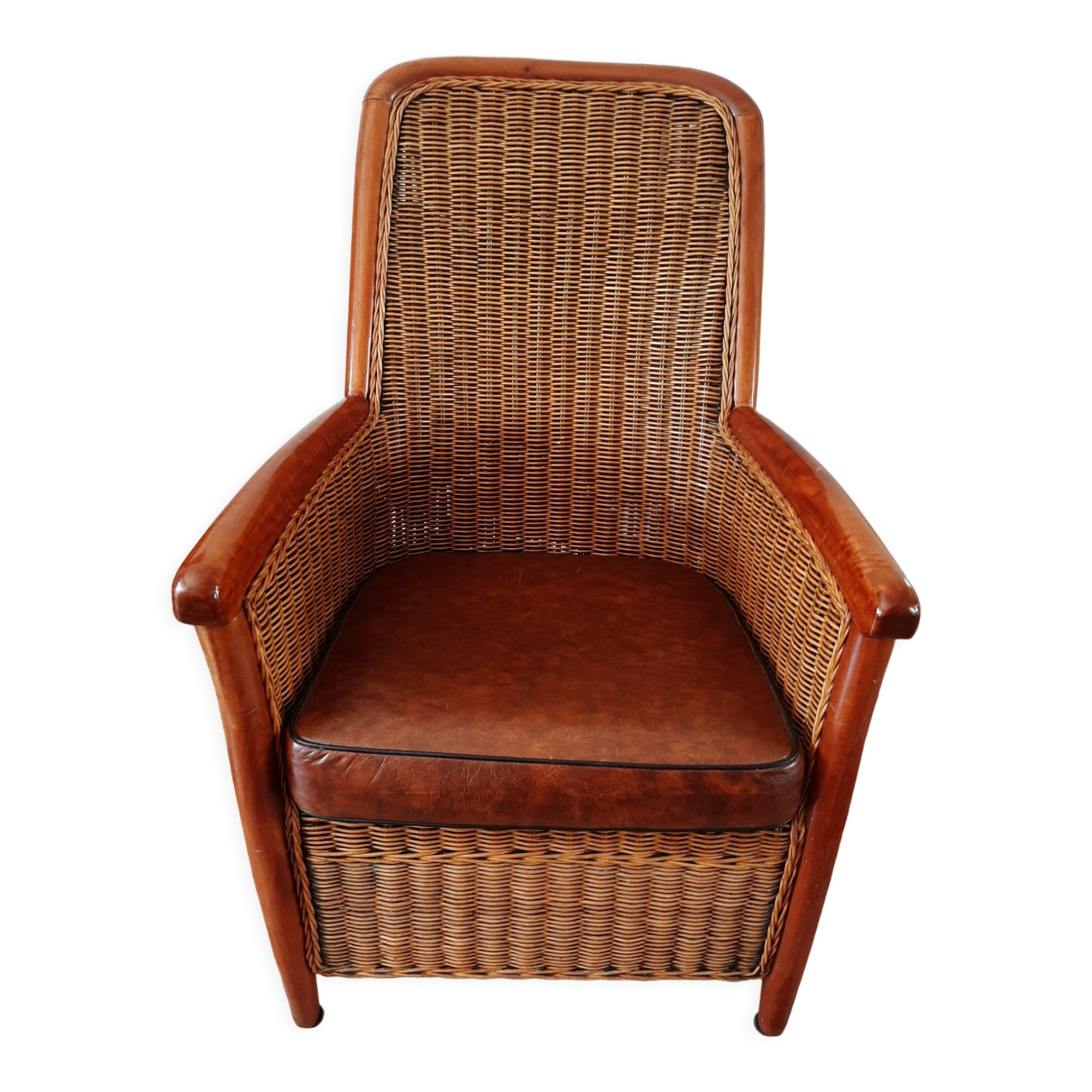 Armchair in woven rattan and exotic wood