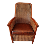 Armchair in woven rattan and exotic wood