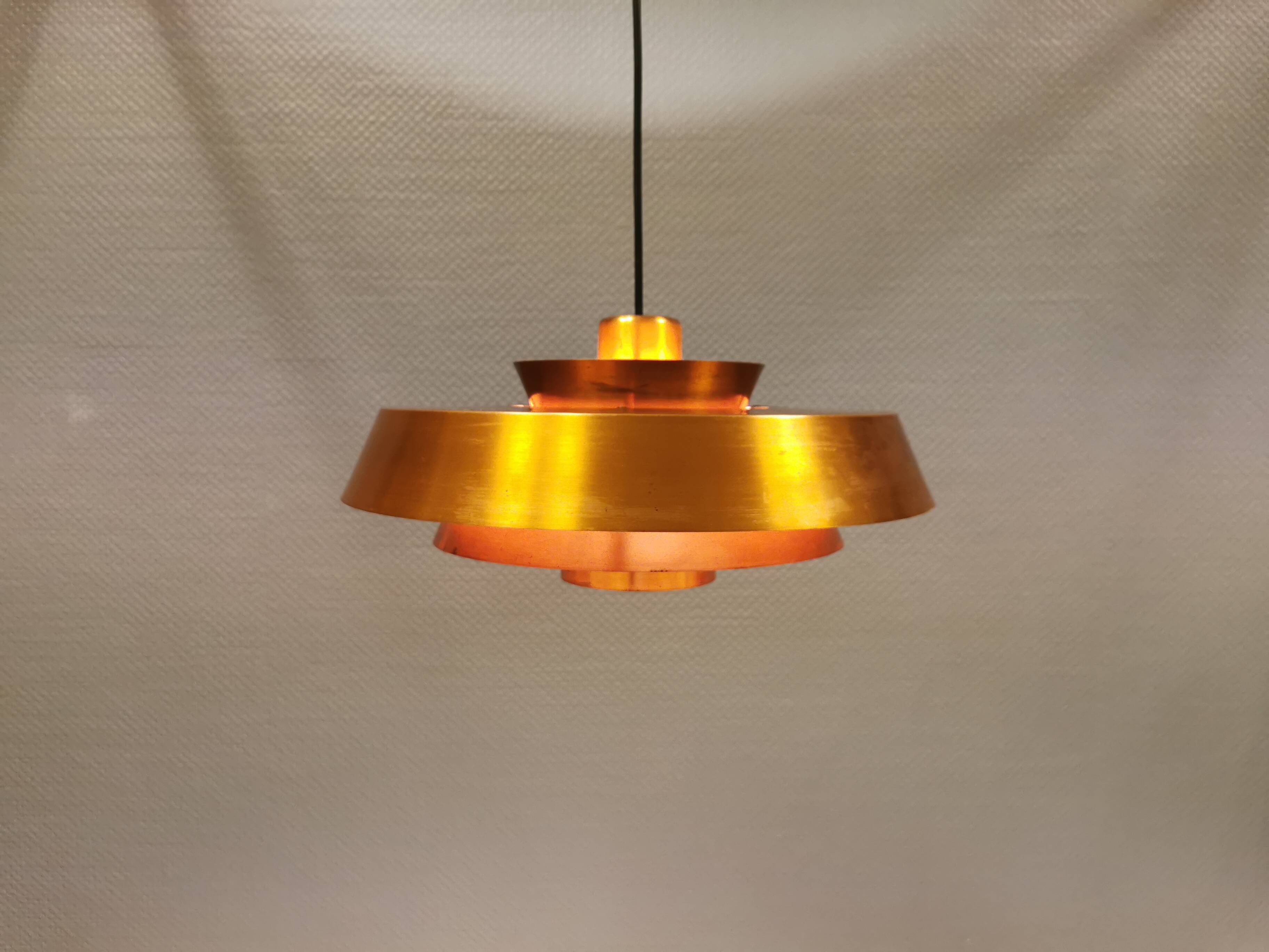 A mid-century Danish hanging lamp in copper by Jo Hammerborg for Fog & Mørup.
