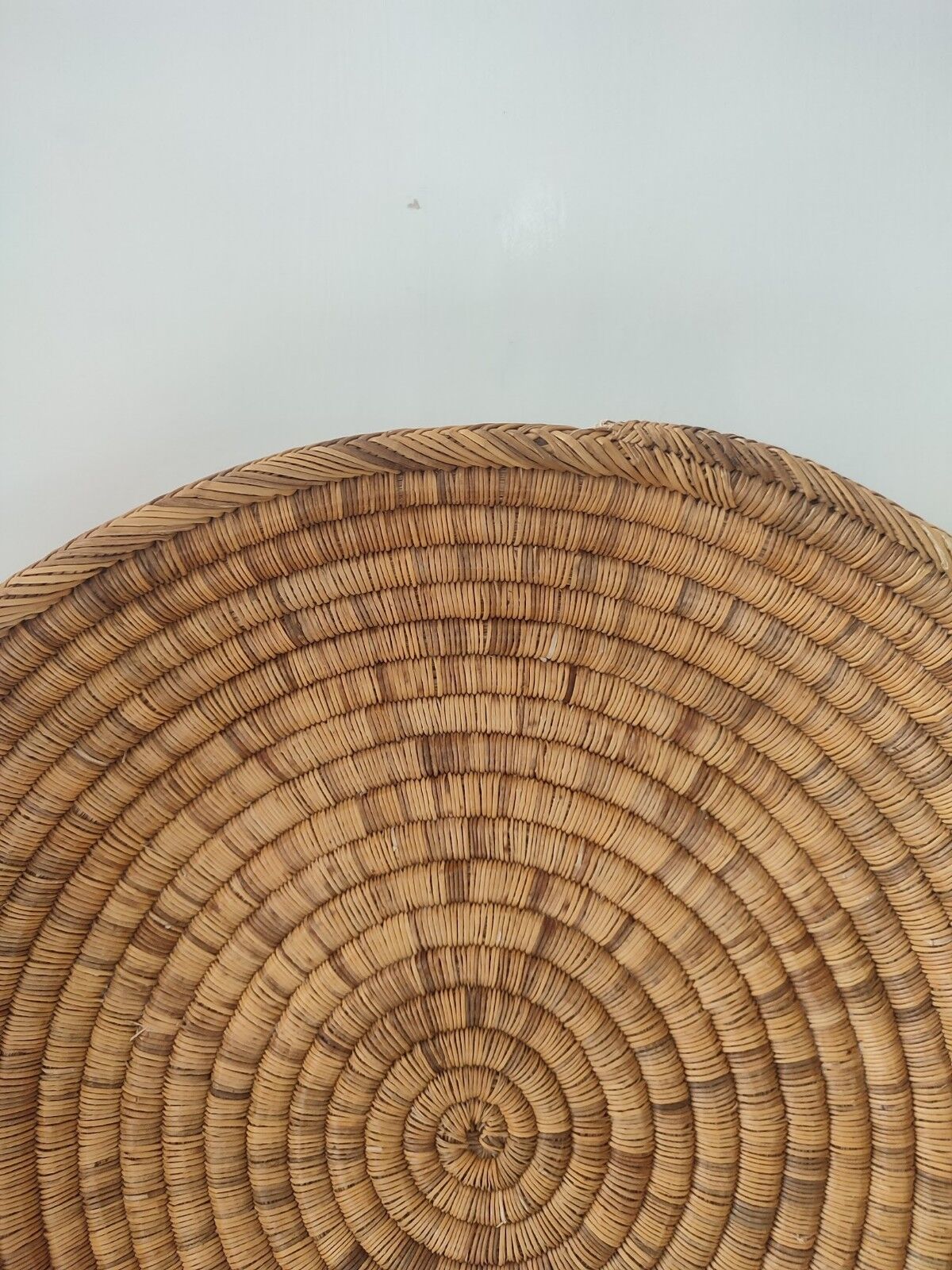 Ethnic plateau in woven palm leaf