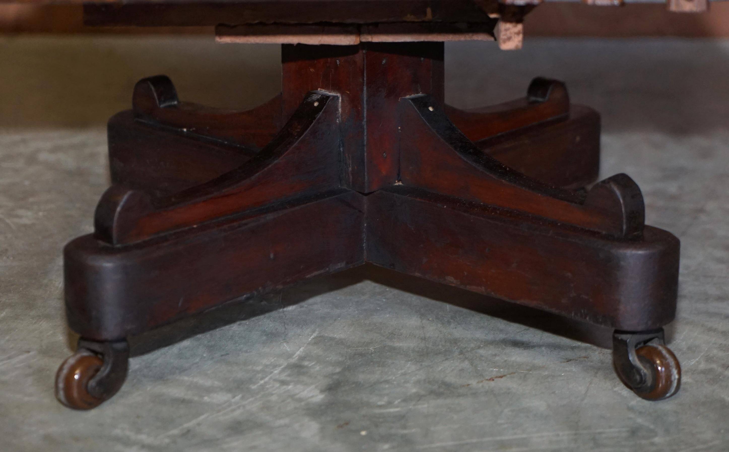 Edwardian revolving bookcase in hardwood with Sheraton inlay.