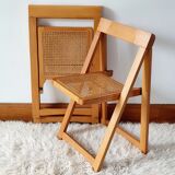 Pair of canned folding chairs.