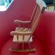 Toy wooden rocking chair.