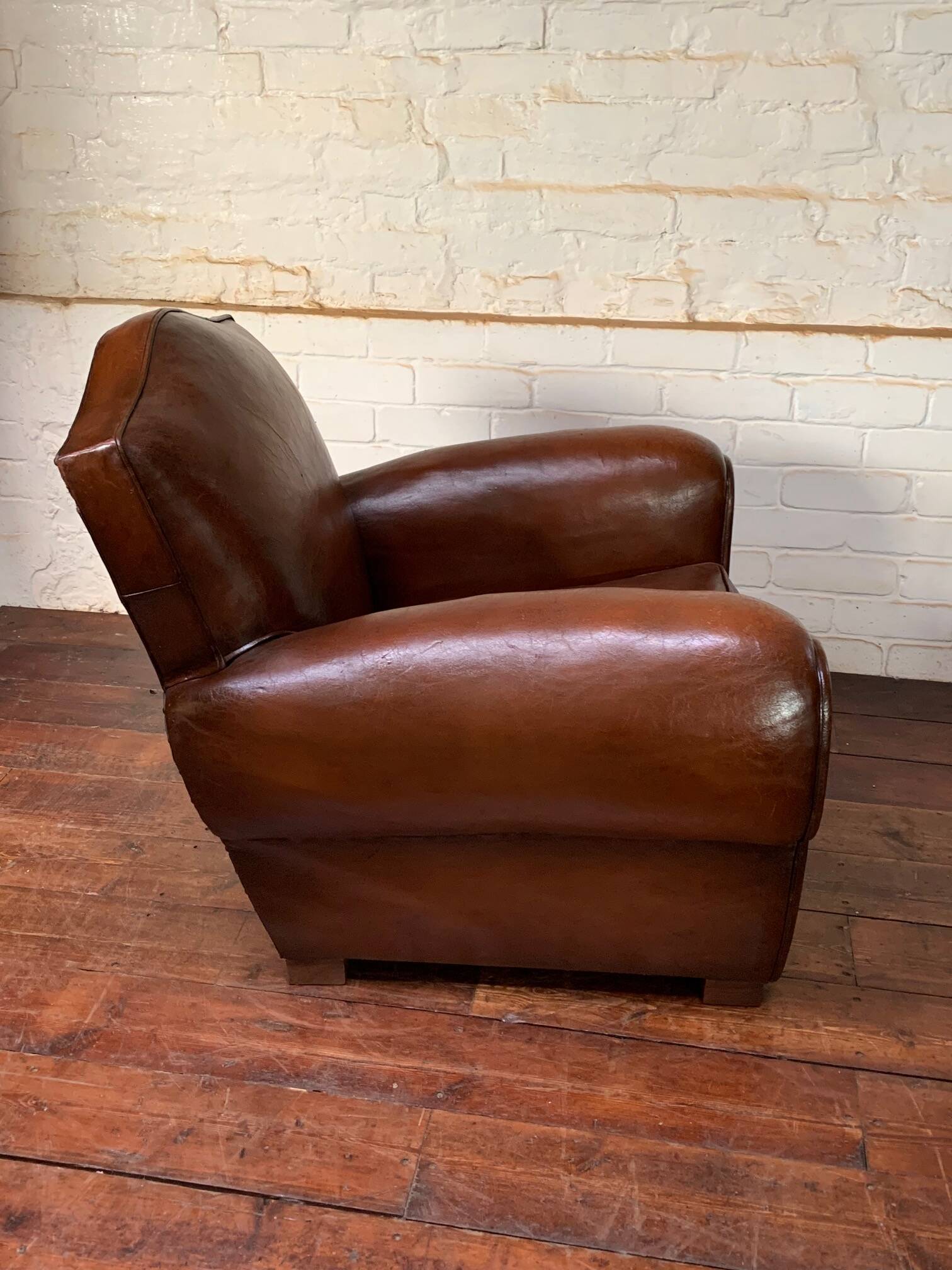 French leather club chair, chapeau de gendarme model circa 1950’s