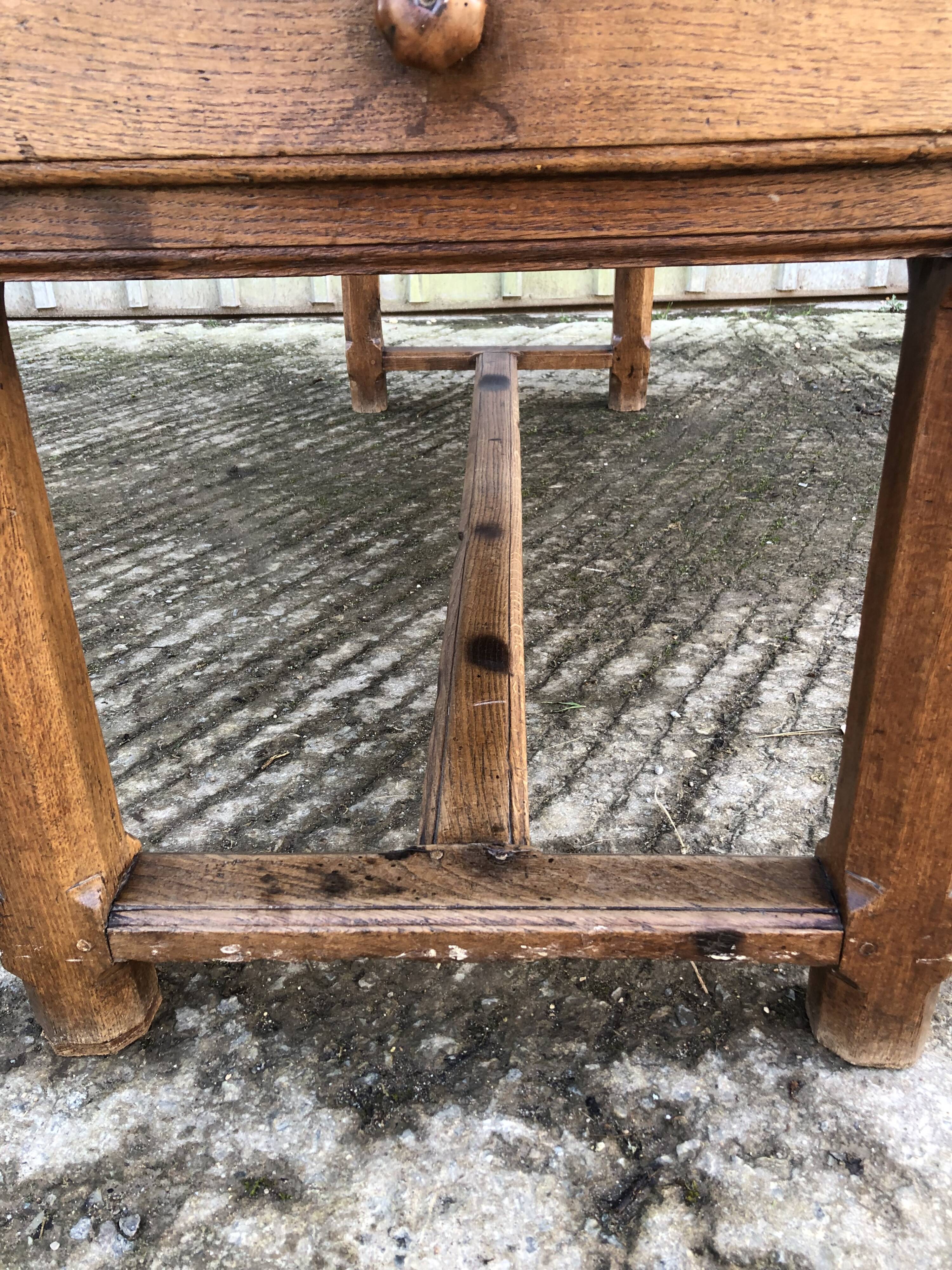Antique oak farmhouse table with cat bar and 2 end drawers