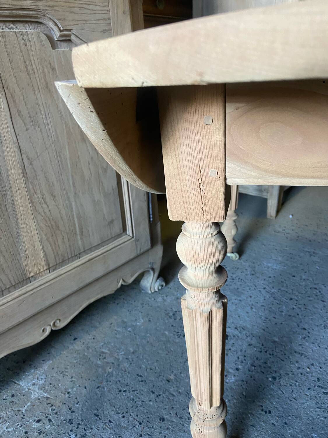 Oval wooden table on wheels.