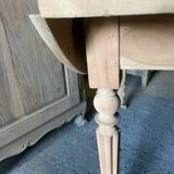 Oval wooden table on wheels.