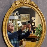 Golden oval mirror