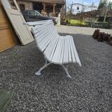 Old cast iron garden bench and wooden slats