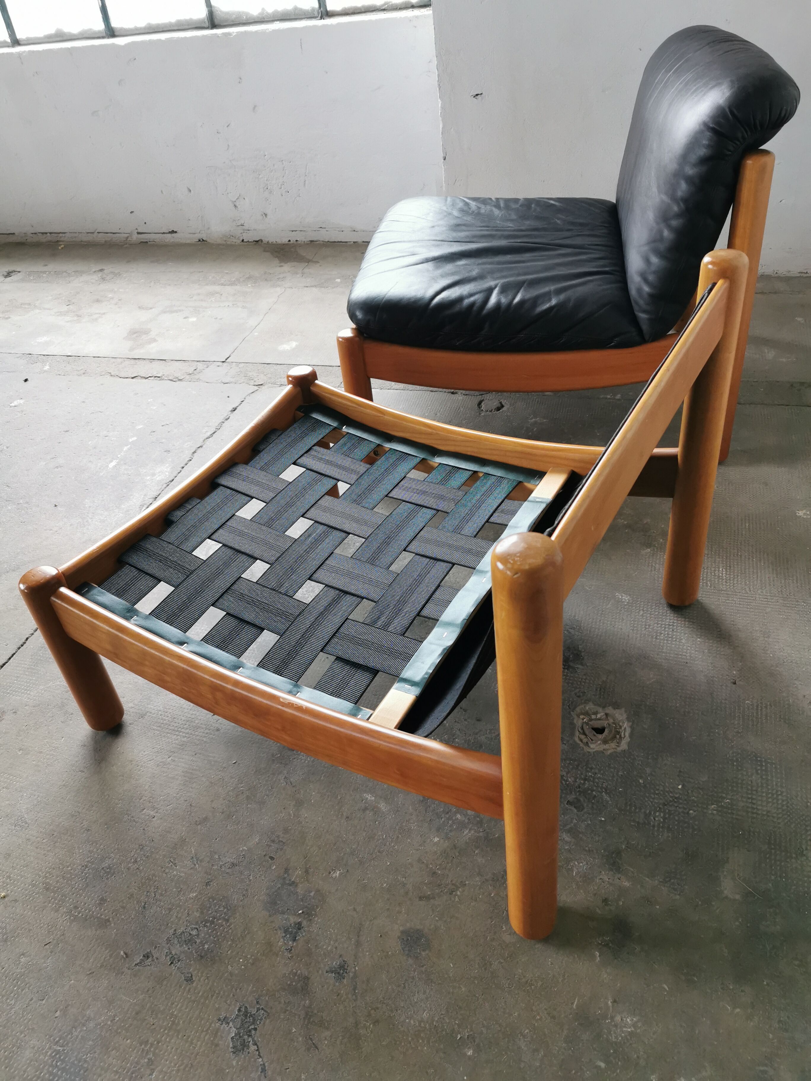 Pair of designer leather armchairs 80s