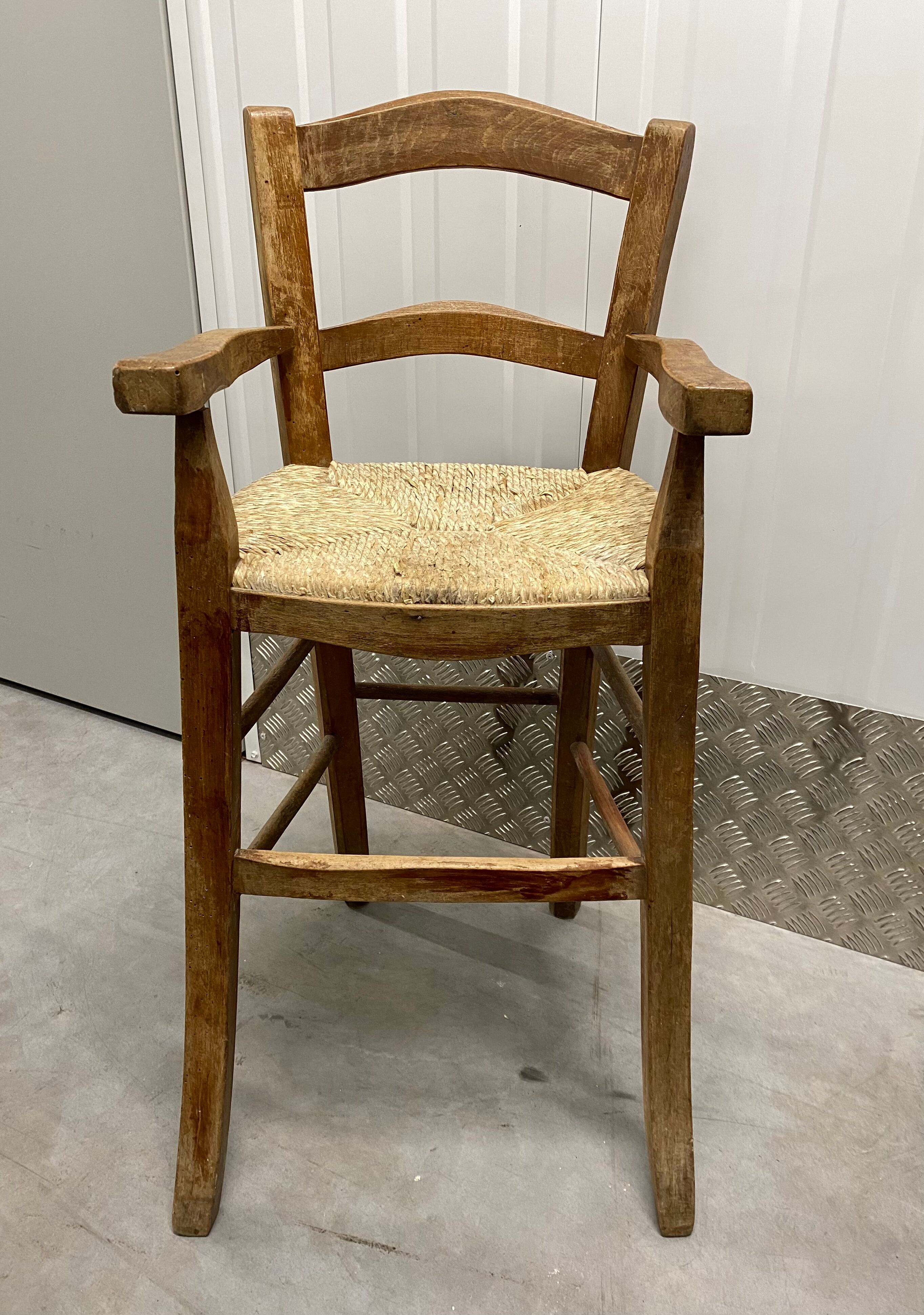 Wooden children's high chair and mulched seat