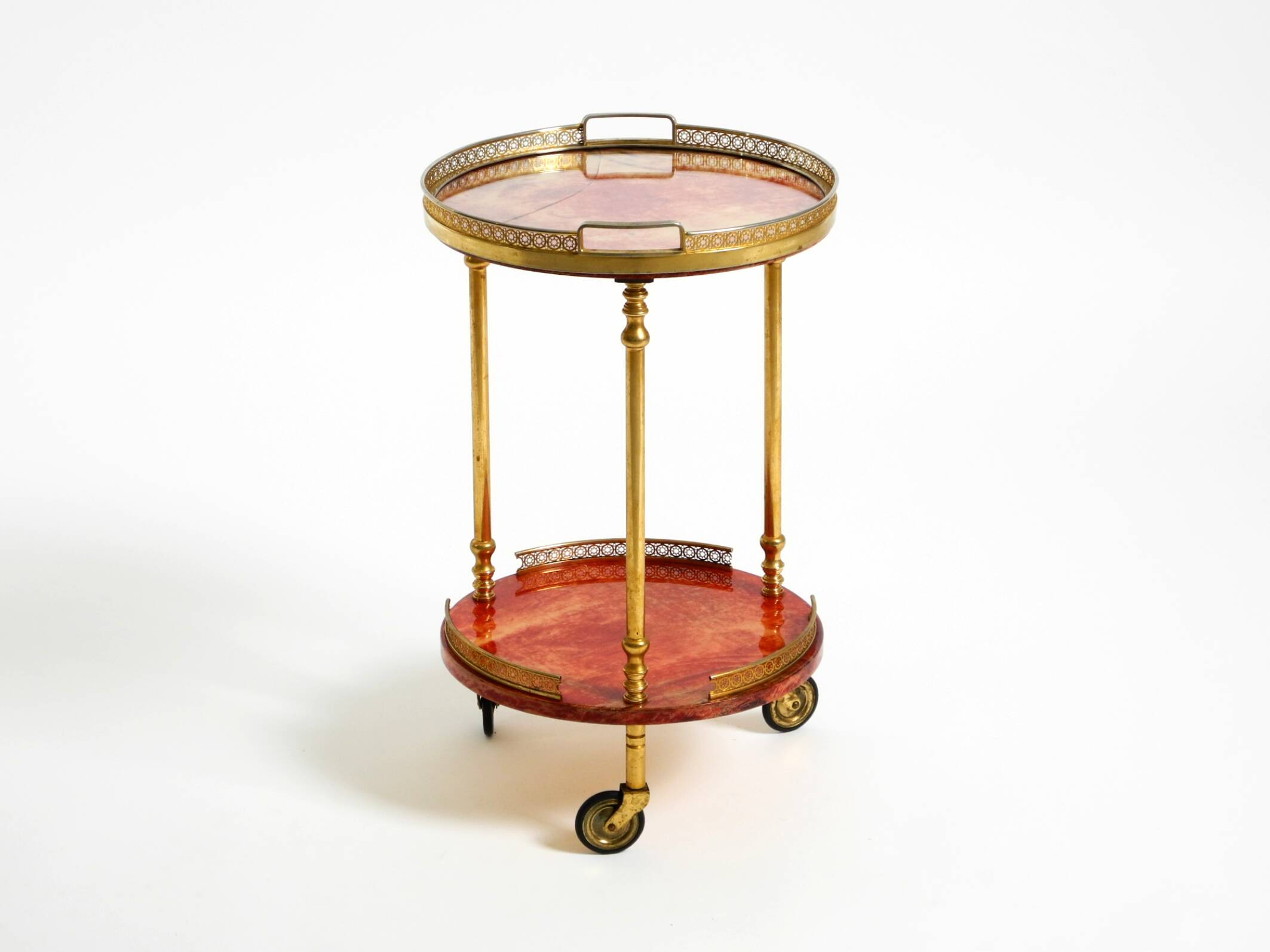 Round, small 1960s Aldo Tura serving or bar trolley in red goatskin leather