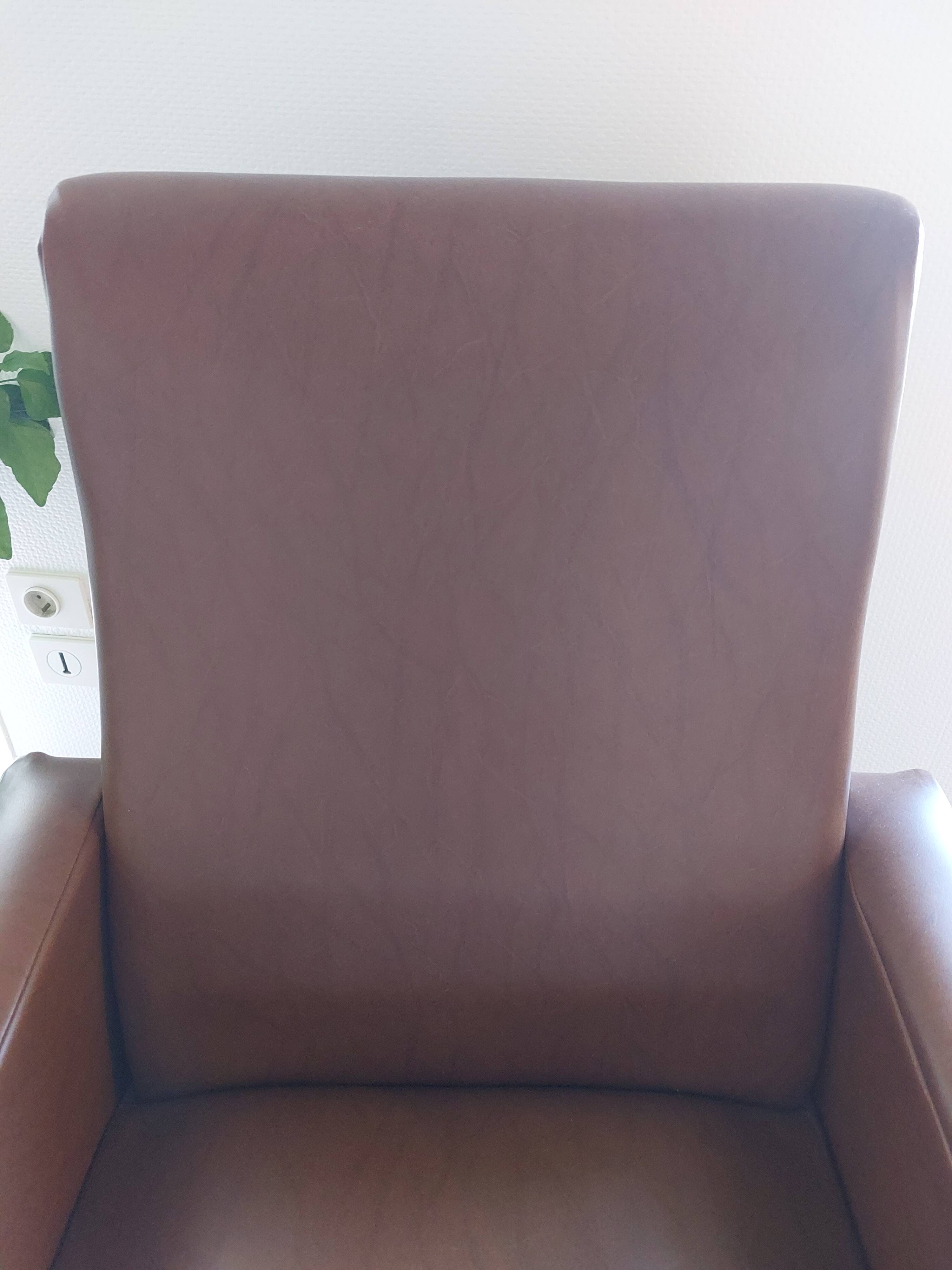 a pair of comfortable vintage armchairs with splayed legs