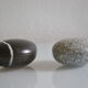 2 boxes in lithographed sheet metal in the shape of a pebble
