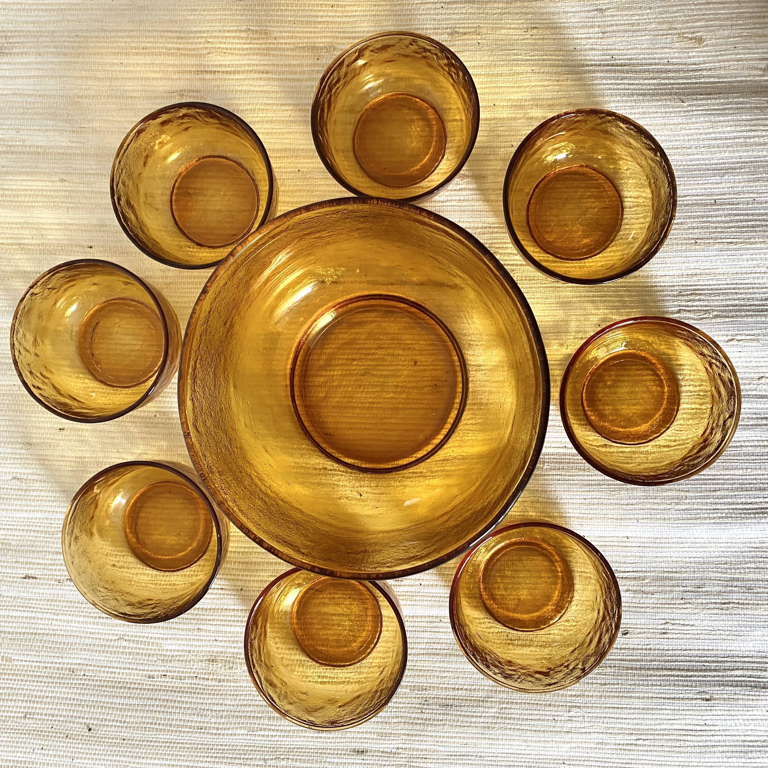 Salad bowl and bowls in amber glass, 70s