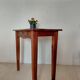 Small antique solid wood table in chic country style with a drawer.