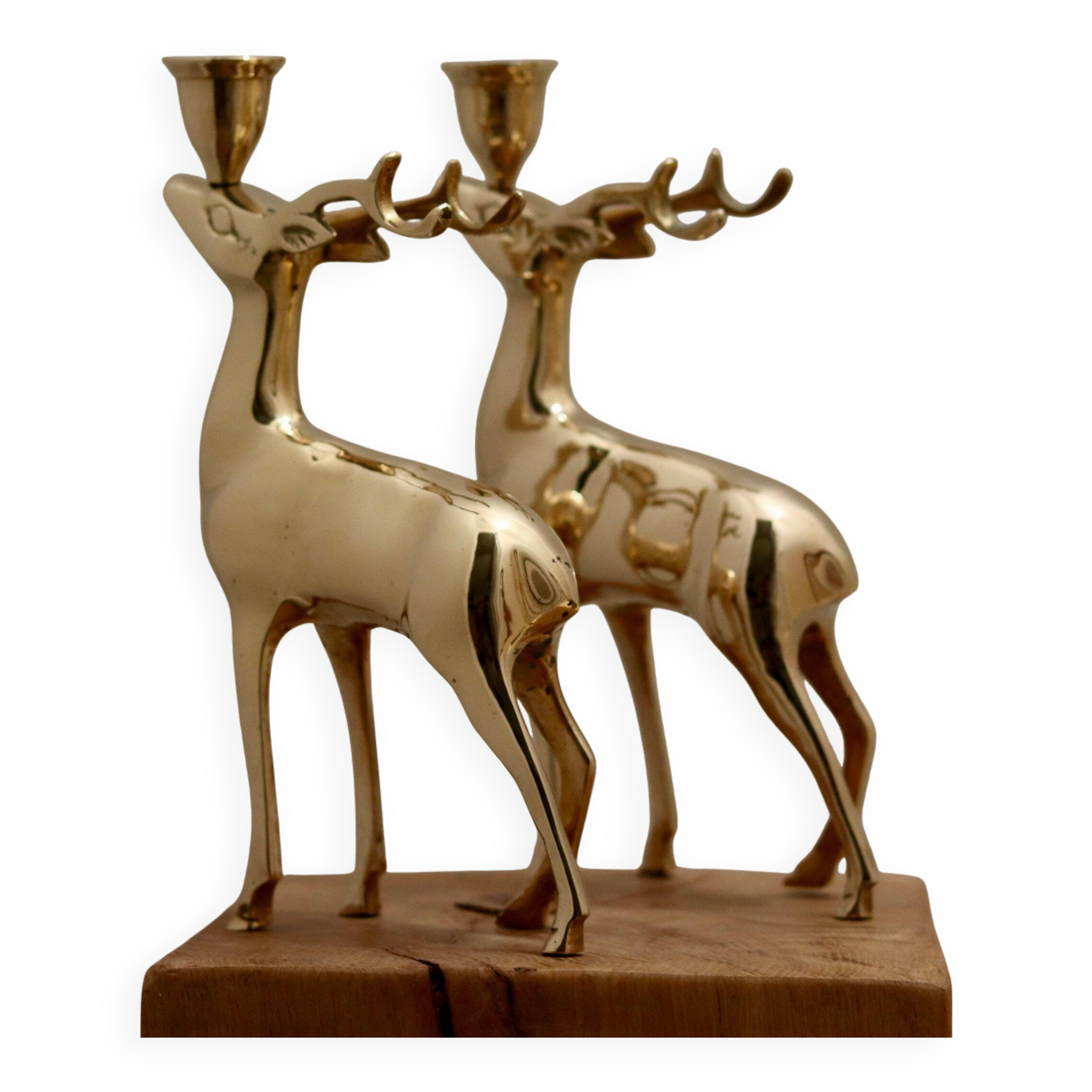 Pair of brass candle holders in the shape of deer from the mid-century.