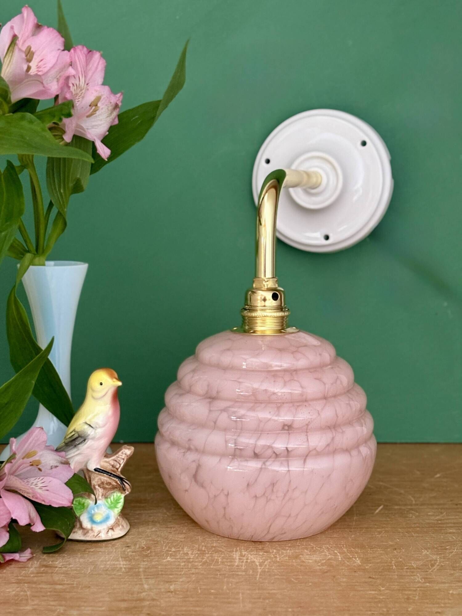 Vintage pink Clichy glass globe wall light.