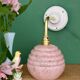 Vintage pink Clichy glass globe wall light.