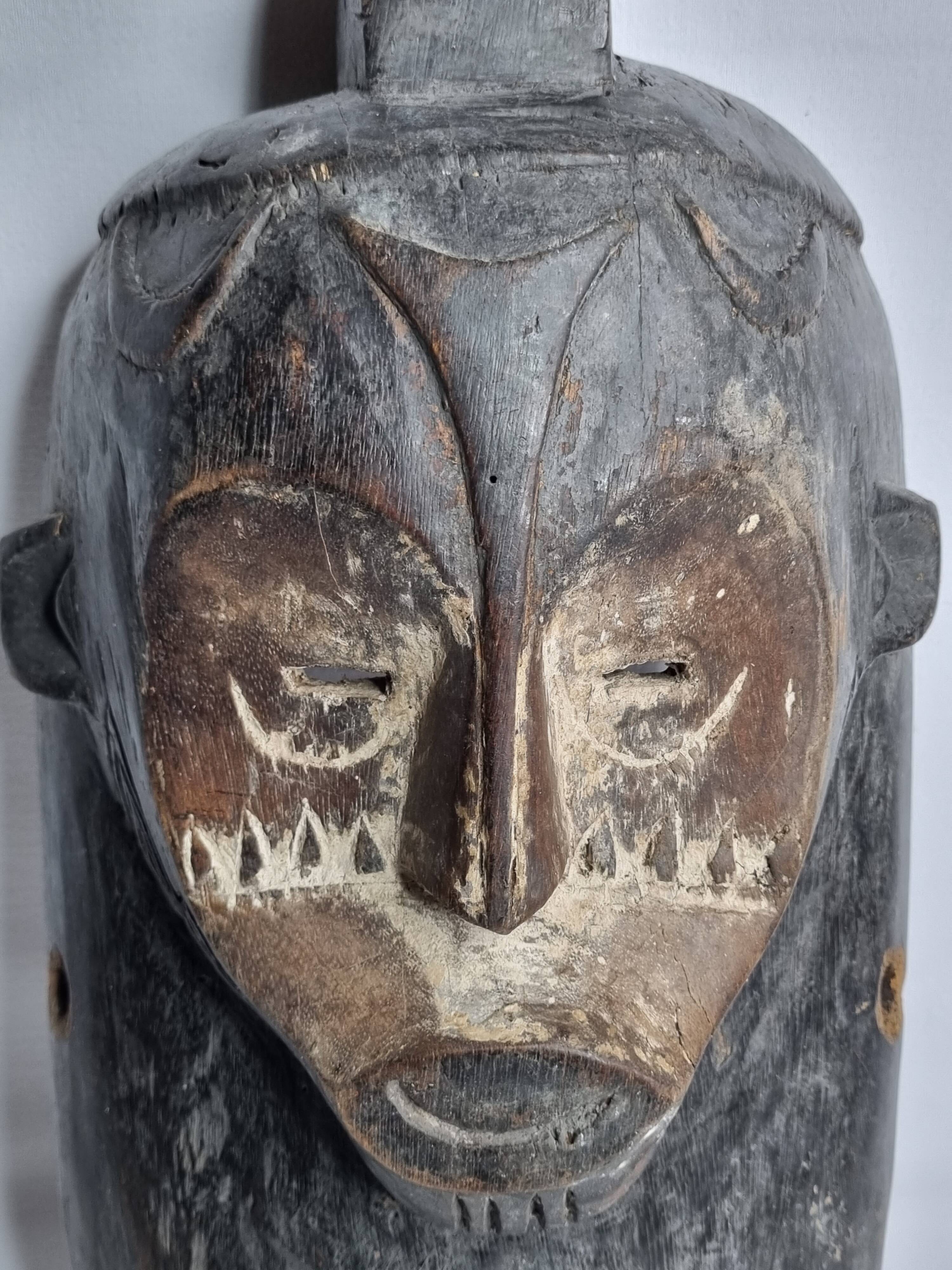 Ancient Fang Ngil tribal mask, traditional African art, Gabon, 20th century, 40 cm