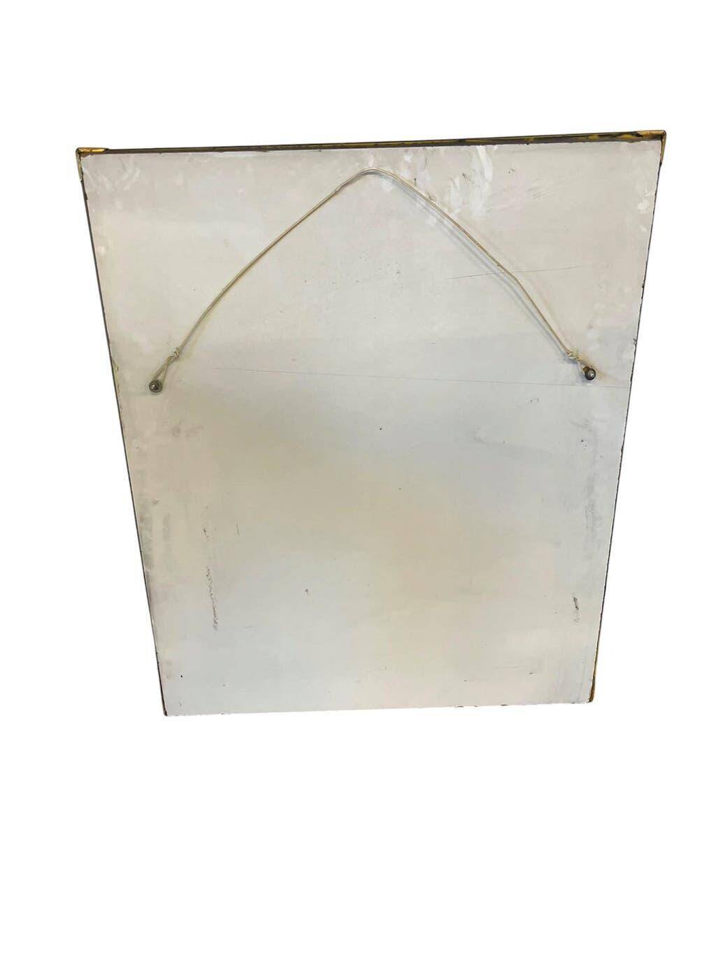 Vintage gold wall mirror with a smoked mirror border.