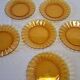 6 Duralex dessert plates in good condition, made of amber-yellow glass