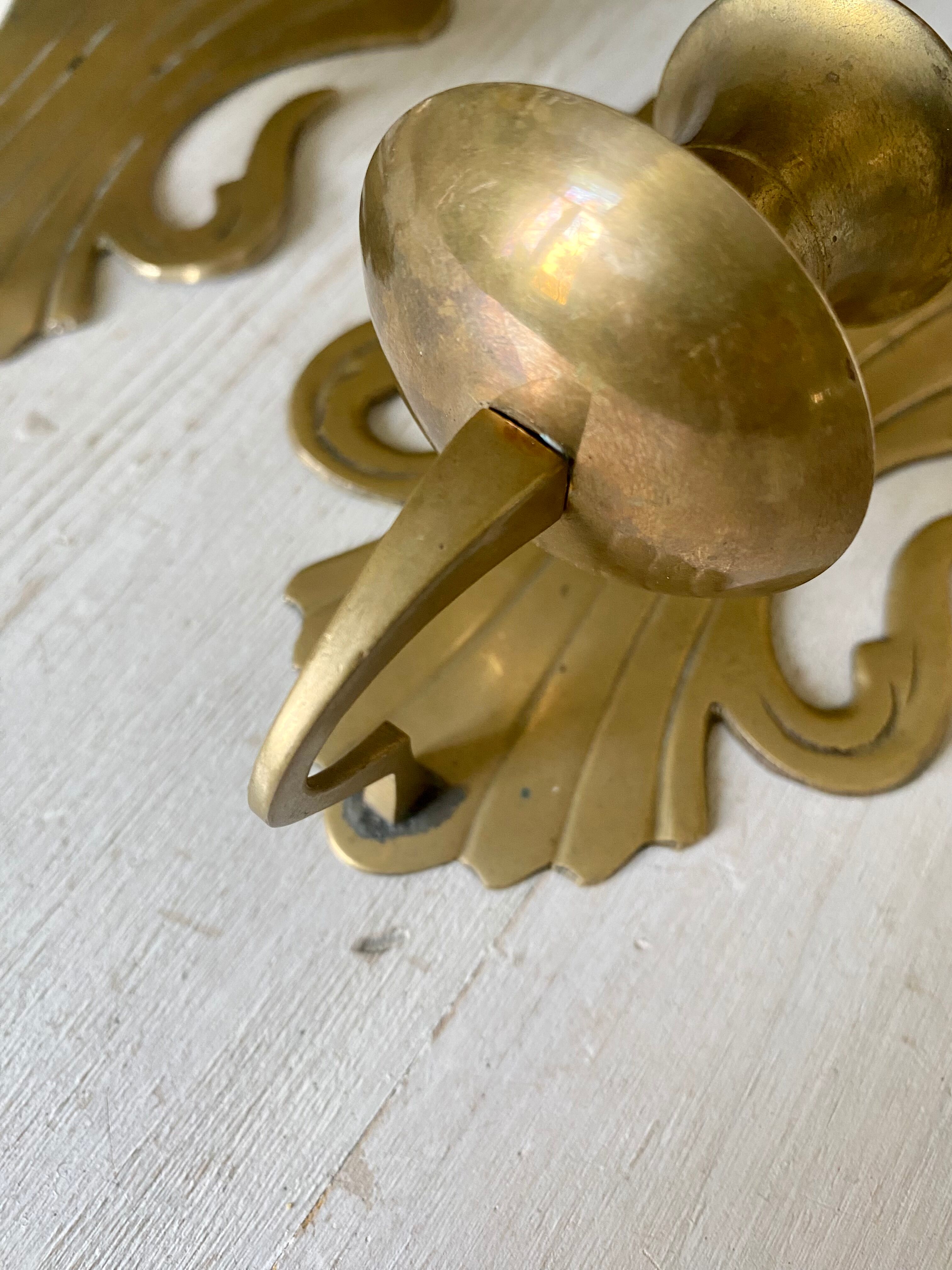Pair of brass wall candle holders