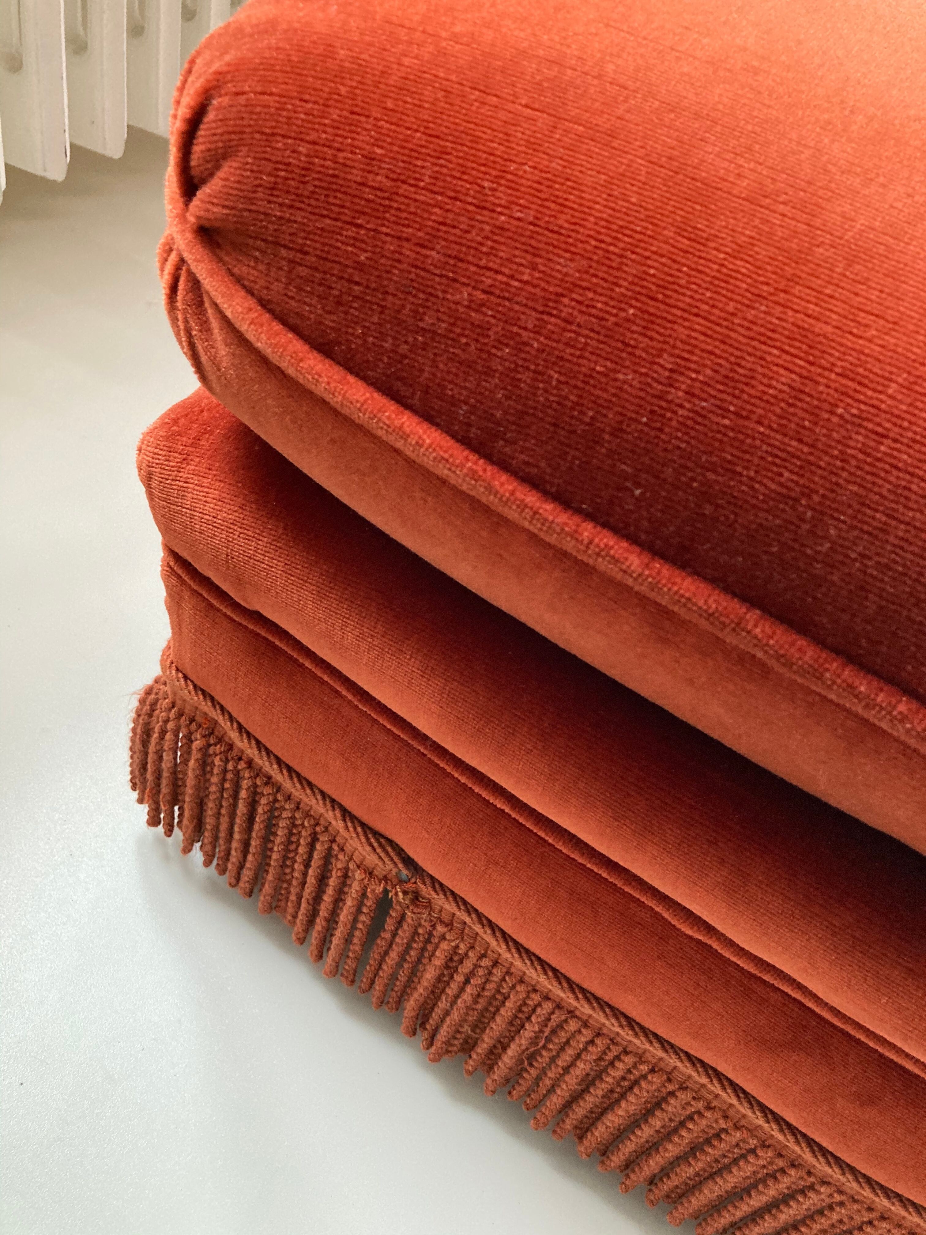 Vintage Jean Roche pouf in orange velvet with fringes
