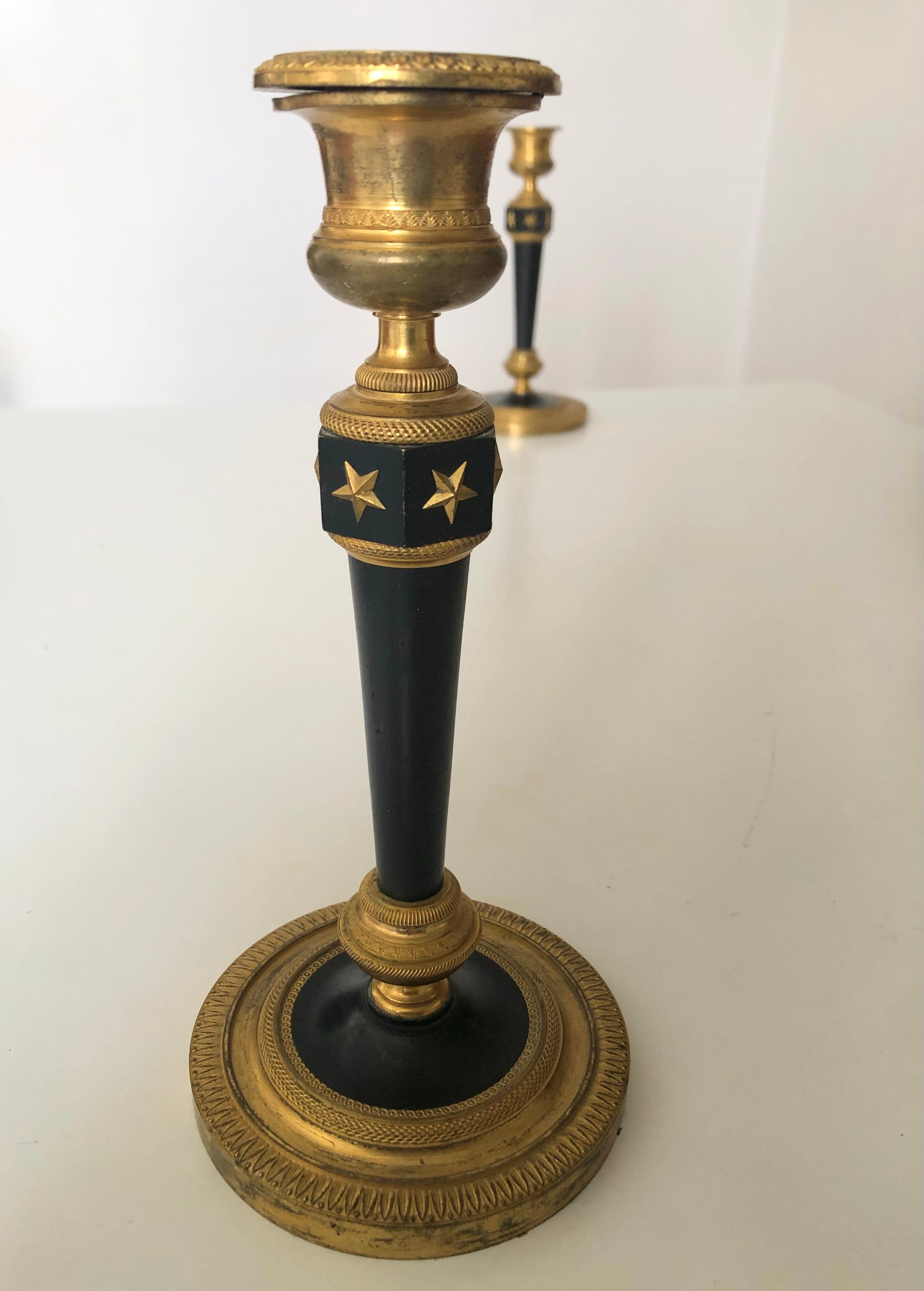 Pair of bronze candle holders empire era
