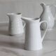 3 old French pitchers in white ceramic