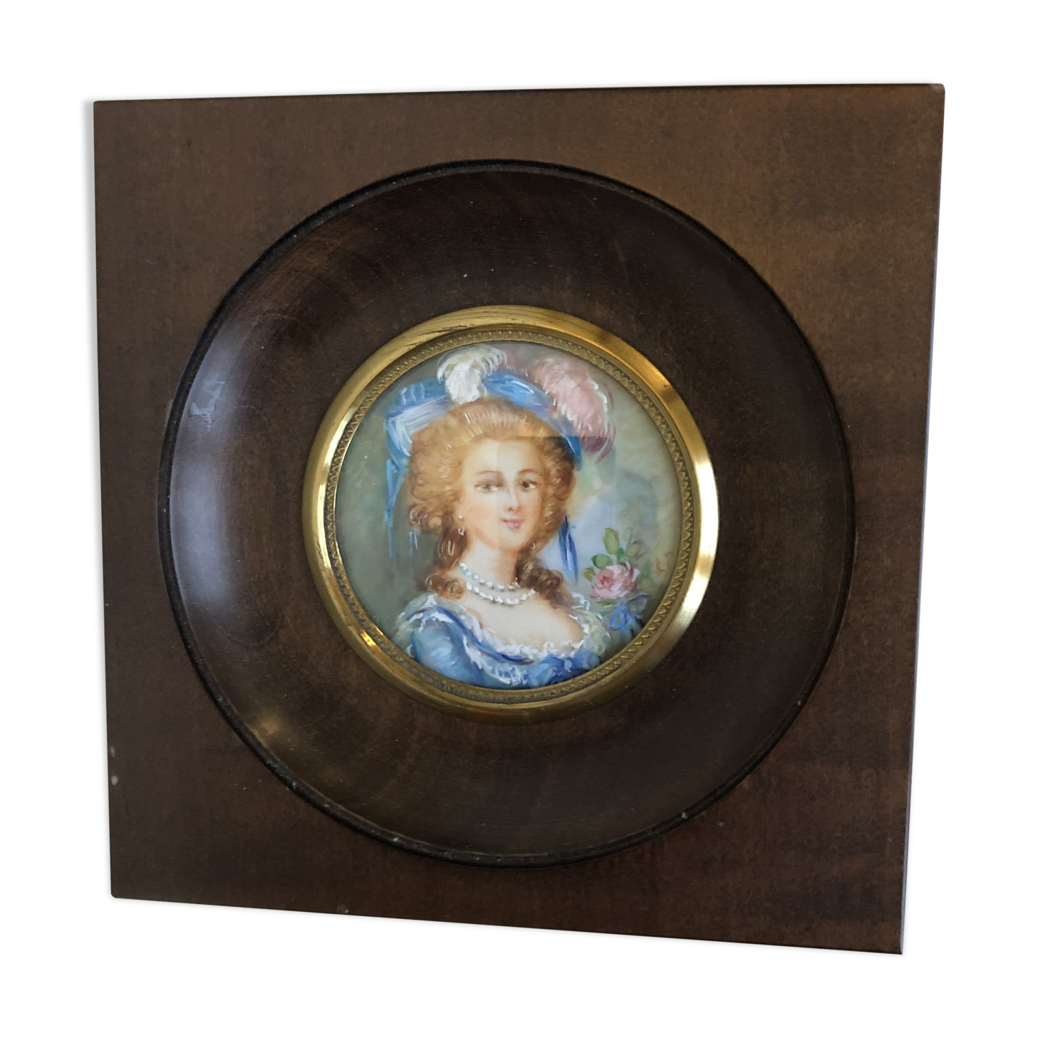 Elegant miniature in blue hat